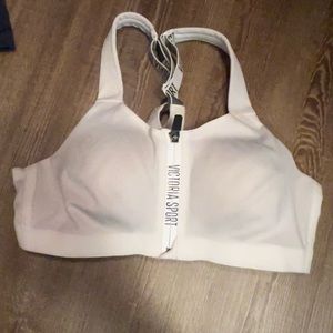 Clasp and zip sports bra